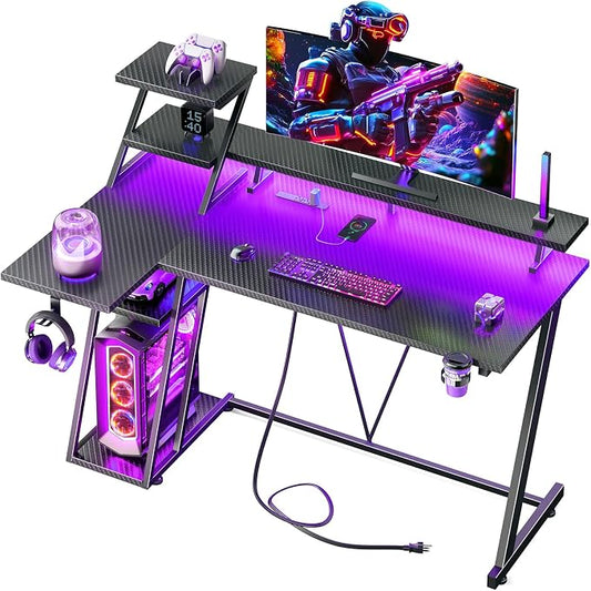 Korfile 47 Inch Gaming Desk with LED Lights & Power Outlet, L Shaped Computer Desk with Storage Shelves, Gamer Workstations with Monitor Stand for Bedroom, Carbon Fiber Black